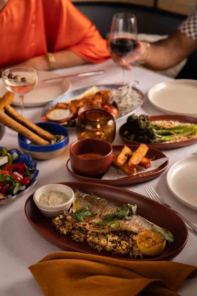 Table with assortment of dishes at Cleo Miami restaurant